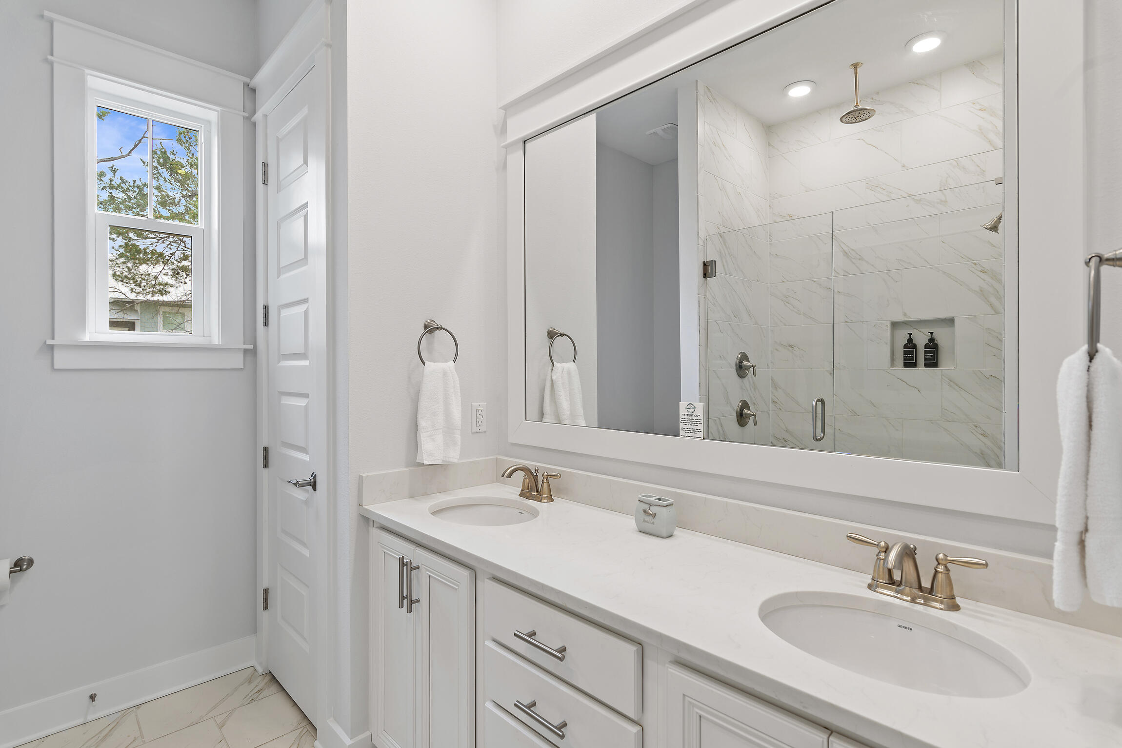 38 Pine Lands Loop East, Unit A Inlet Beach, FL 32461 - Photo 16 of 25 a bathroom with a double vanity sink mirror and double