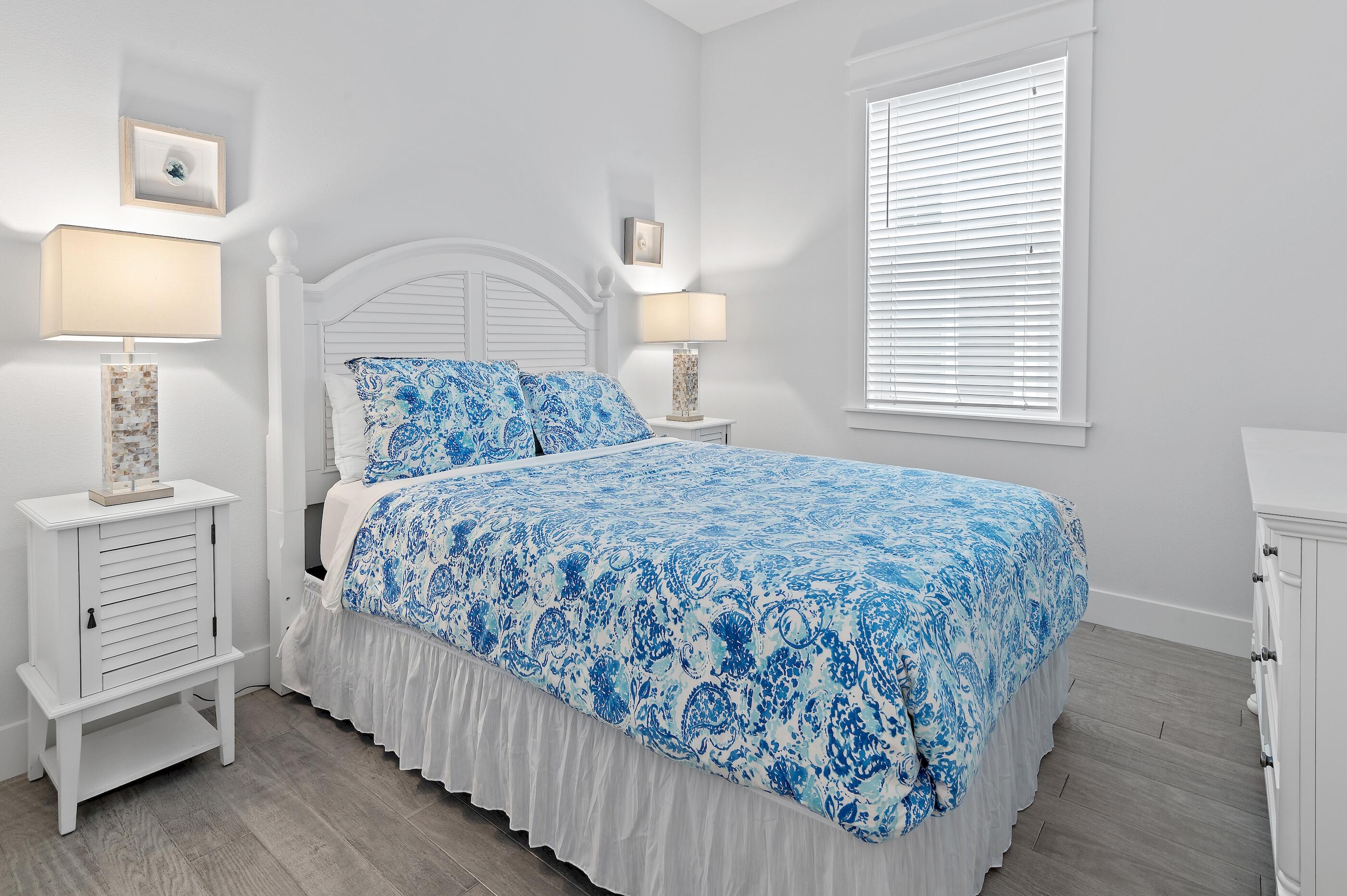 38 Pine Lands Loop East, Unit A Inlet Beach, FL 32461 - Photo 18 of 25 a bedroom with a bed and a window