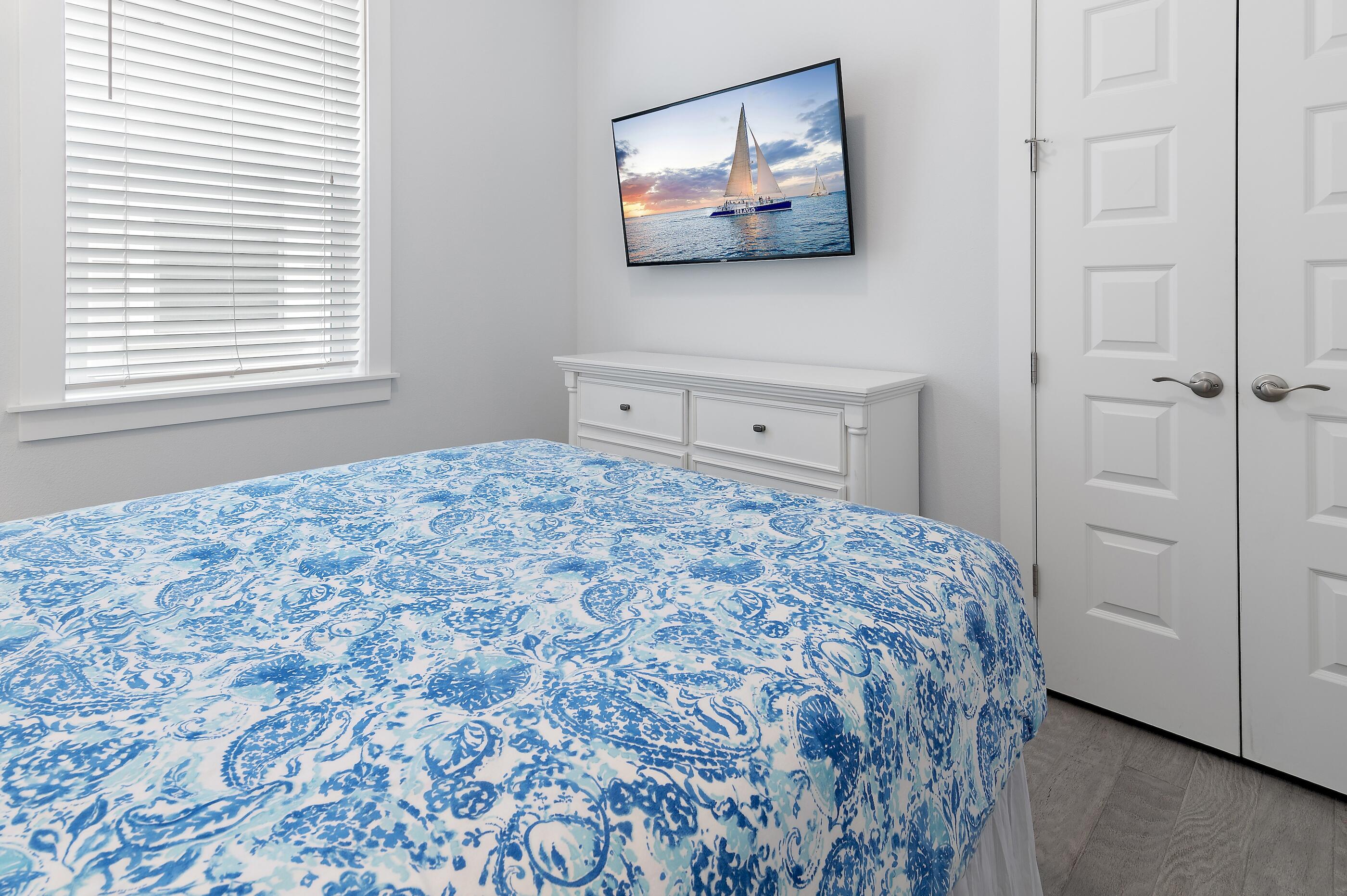 38 Pine Lands Loop East, Unit A Inlet Beach, FL 32461 - Photo 19 of 25 a bedroom with a bed and a window