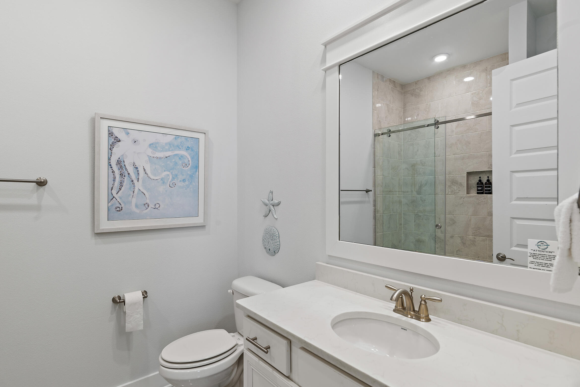 38 Pine Lands Loop East, Unit A Inlet Beach, FL 32461 - Photo 20 of 25 a bathroom with a toilet a sink and mirror