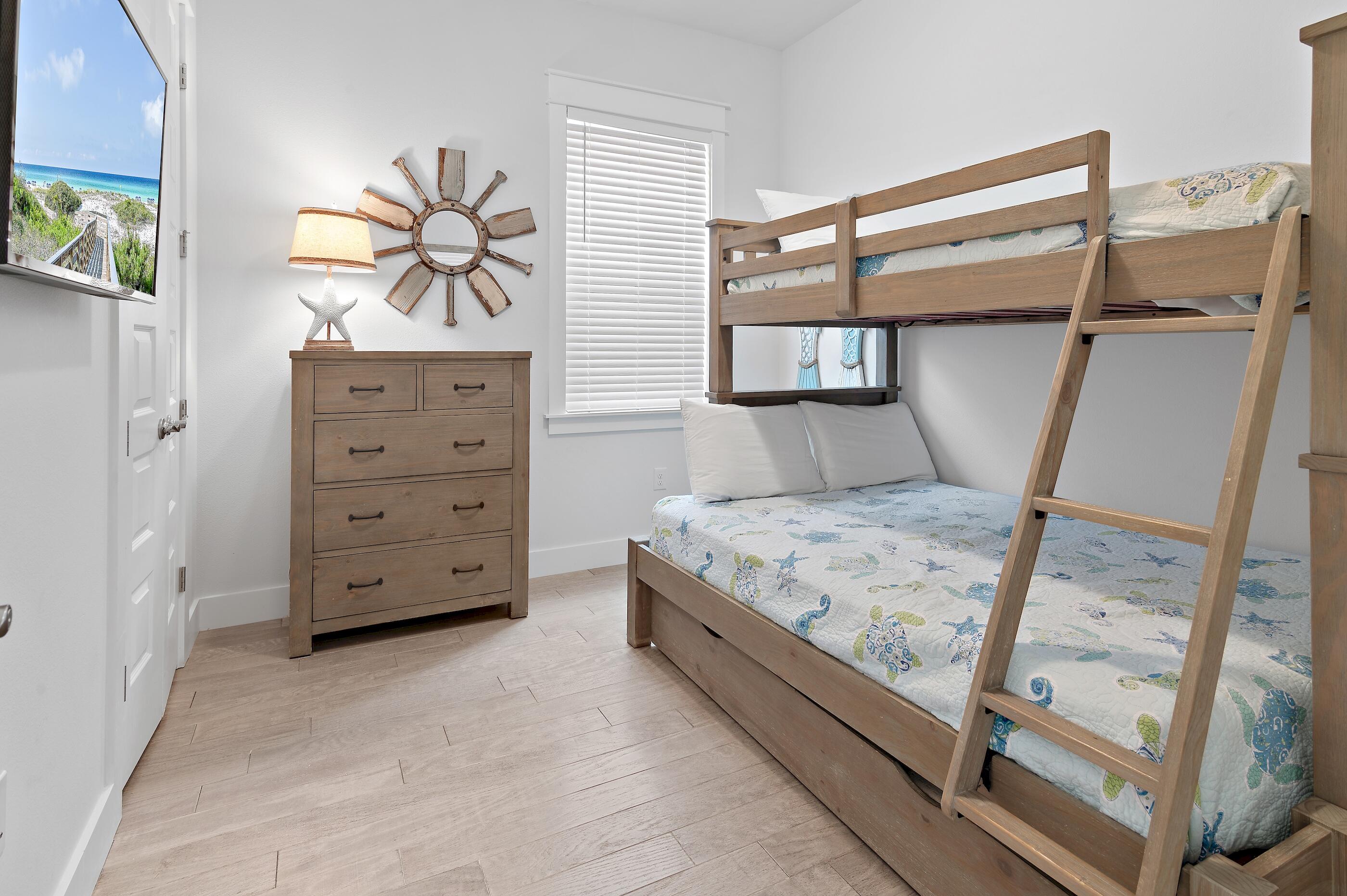 38 Pine Lands Loop East, Unit A Inlet Beach, FL 32461 - Photo 21 of 25 a bedroom with a bed and a window