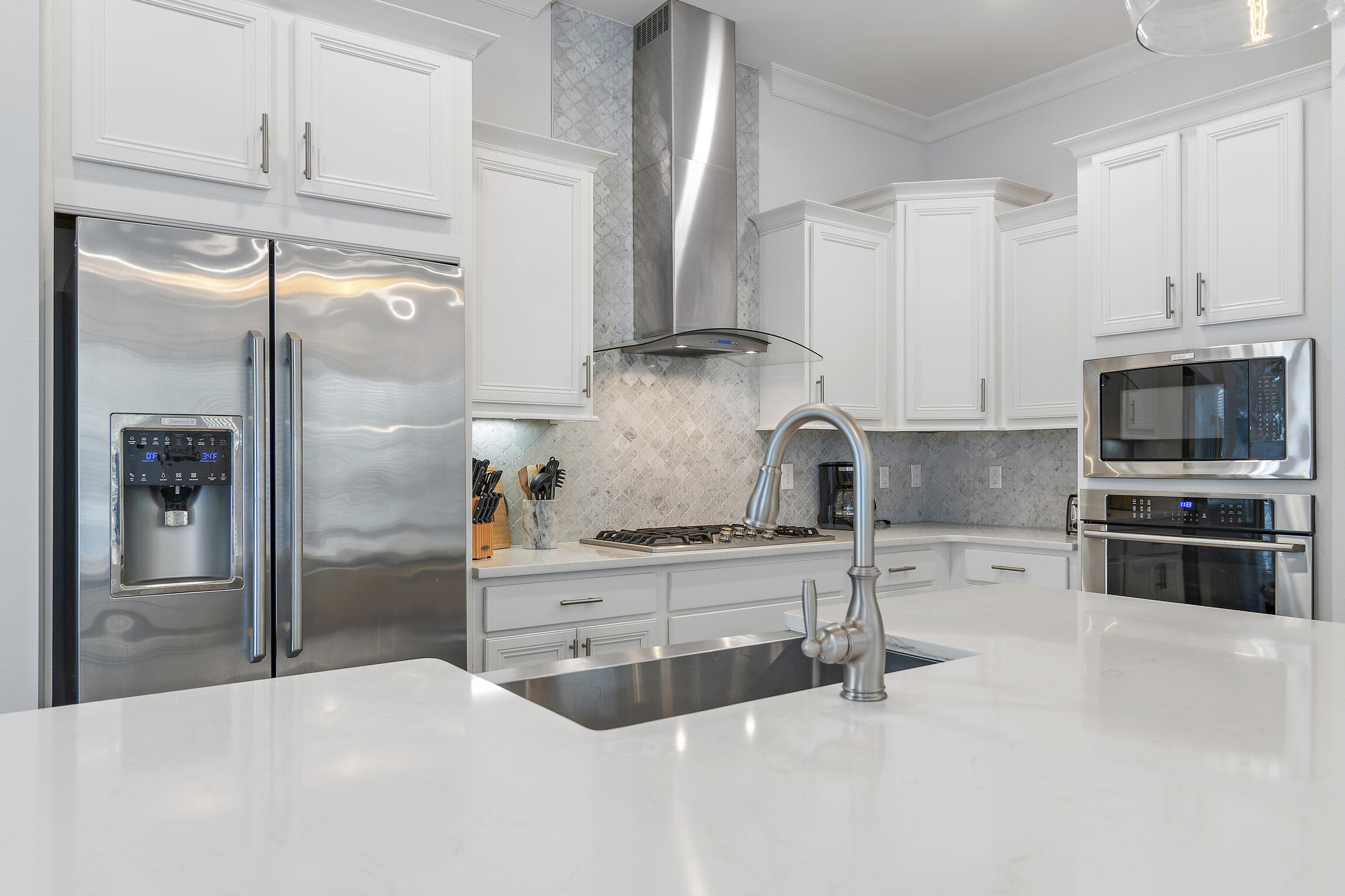 38 Pine Lands Loop East, Unit A Inlet Beach, FL 32461 - Photo 8 of 25 a kitchen with stainless steel appliances granite countertop a refrigerator and a stove