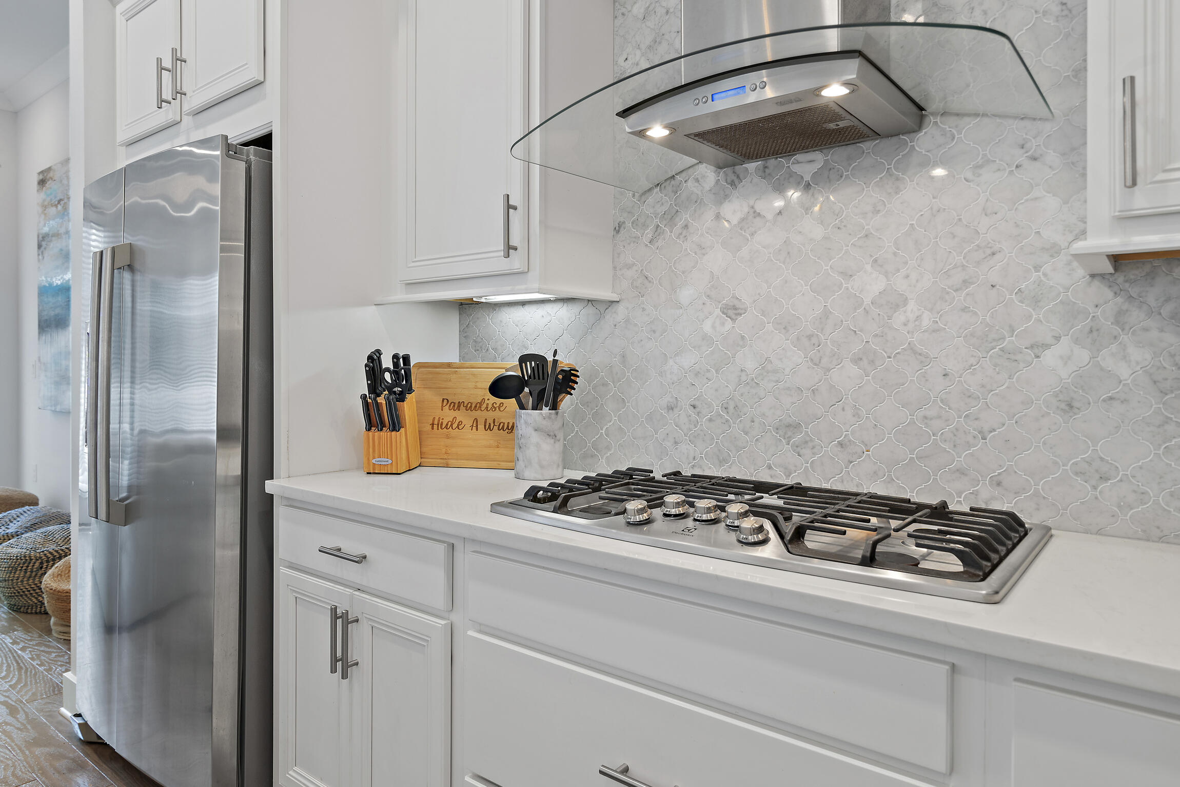 38 Pine Lands Loop East, Unit A Inlet Beach, FL 32461 - Photo 9 of 25 a kitchen with stainless steel appliances granite countertop a sink stove and refrigerator
