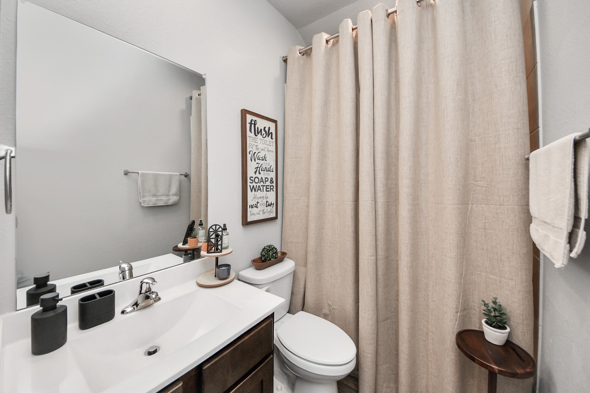 4315 Nervesa Dr. Katy, TX 77449 - Photo 10 of 41 a bathroom with a sink a toilet and shower curtain