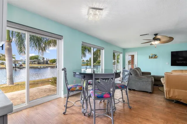 a kitchen with a table and chairs in it