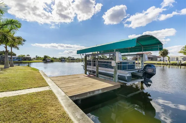 a view of a swimming pool with a table and chairs