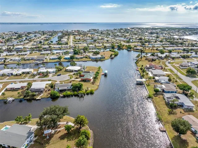 an aerial view of a house with a table and chairs