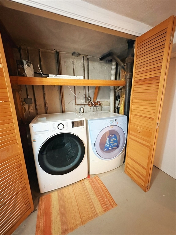 55 Sutherland Road, Unit 55 Arlington, MA 02476 - Photo 23 of 23 a utility room with dryer and washer