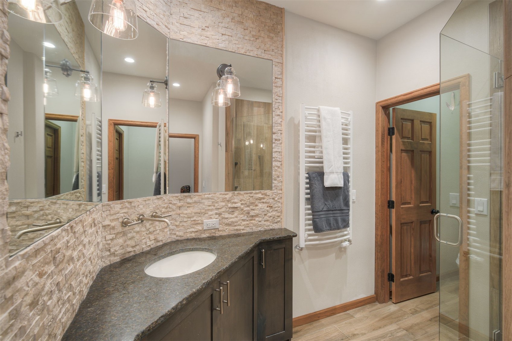2542 Boreas Pass Road Breckenridge, CO 80424 - Photo 25 of 33 a bathroom with a granite countertop sink mirror and shower