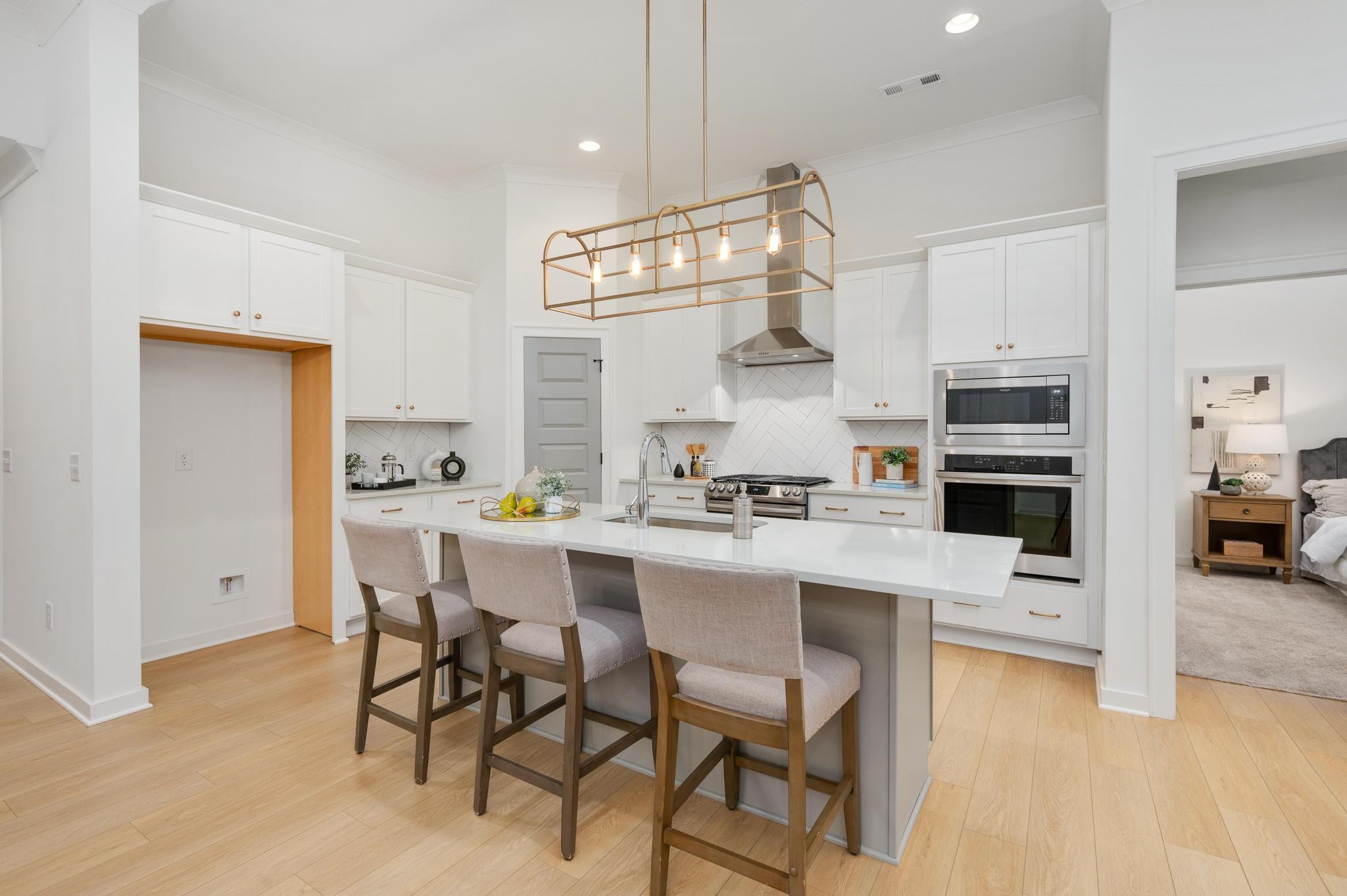 1067 Fallow Road Mount Juliet, TN 37122 - Photo 17 of 47 a kitchen with kitchen island a stove a table and chairs in it