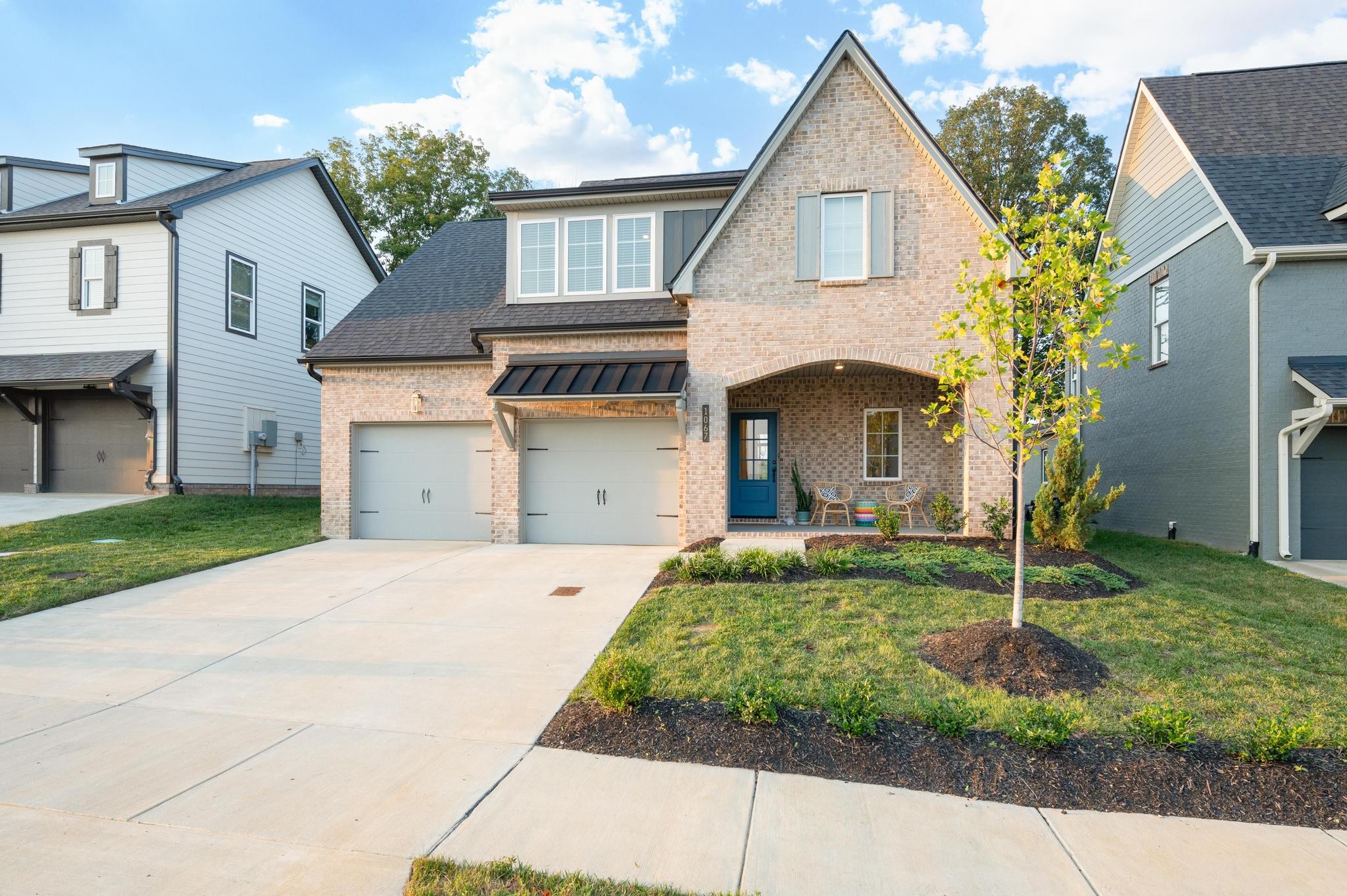 1067 Fallow Road Mount Juliet, TN 37122 - Photo 2 of 47 a front view of a house with a yard and garage