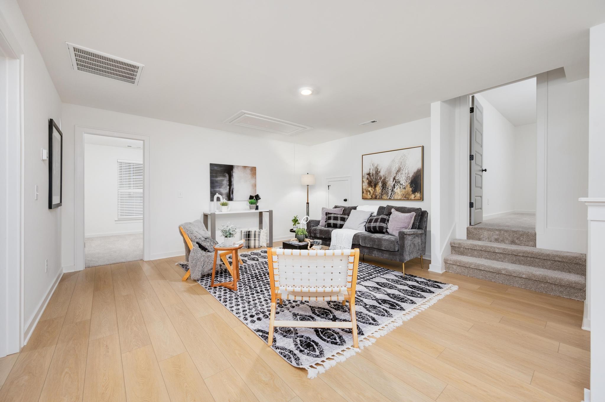 1067 Fallow Road Mount Juliet, TN 37122 - Photo 27 of 47 a living room with furniture and a wooden floor