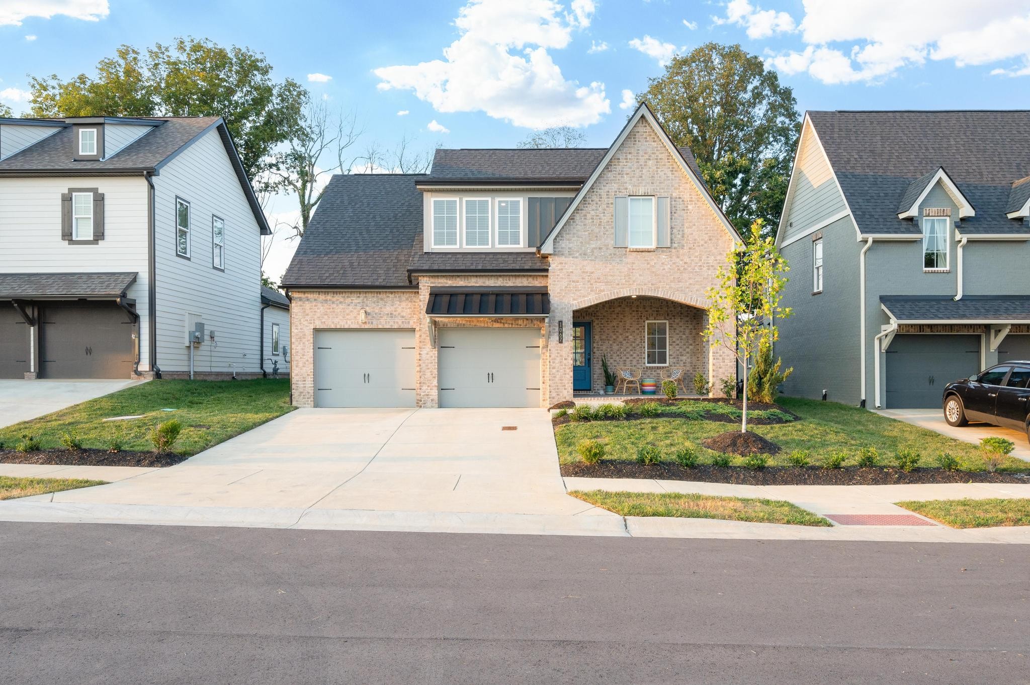 1067 Fallow Road Mount Juliet, TN 37122 - Photo 3 of 47 a front view of a house with a yard and garage