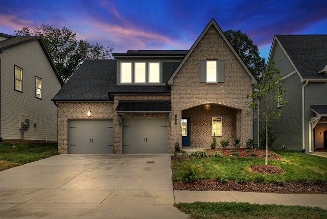 1067 Fallow Road Mount Juliet, TN 37122 - Photo 41 of 47 a front view of a house with a yard and garage