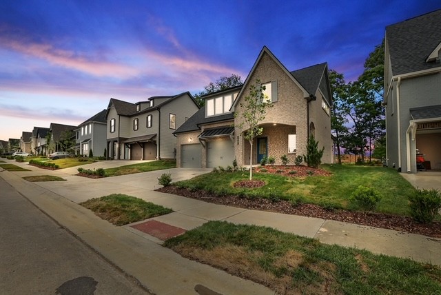1067 Fallow Road Mount Juliet, TN 37122 - Photo 42 of 47 a front view of a house with a yard and garage