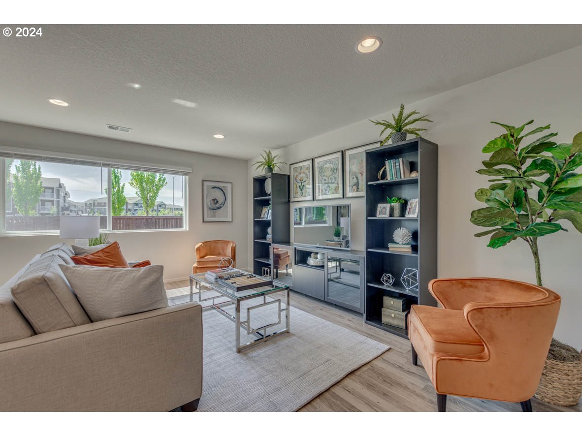 2615 U Street Springfield, OR 97477 - Photo 4 of 14 a living room with furniture and a potted plant