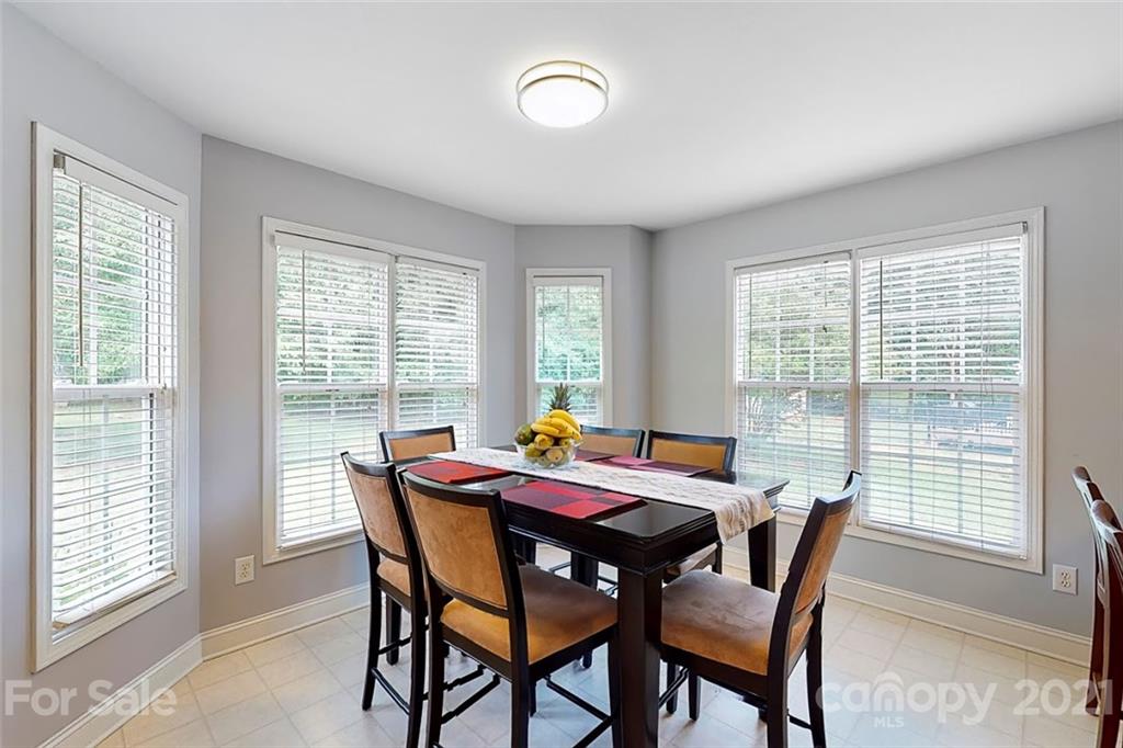 678 Maple Ridge Circle Salisbury, NC 28147 - Photo 22 of 36 a view of a dining room with furniture and a large window