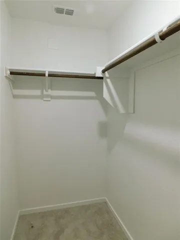 a view of an empty walk in closet