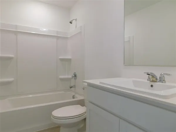 a bathroom with a sink a toilet and a bathtub