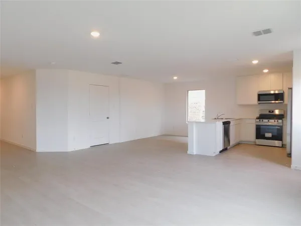 a view of a kitchen with a sink