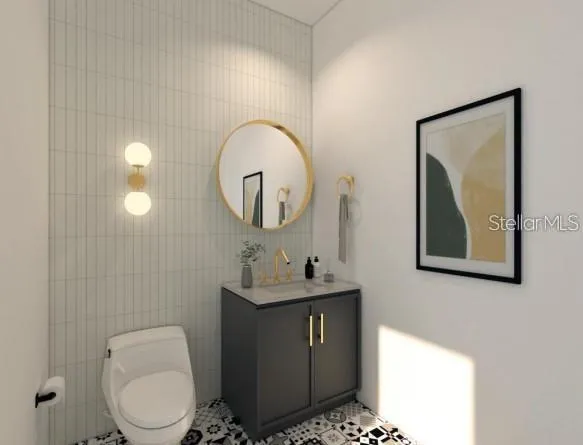a bathroom with a toilet sink vanity and mirror