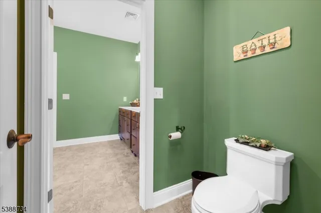 a bathroom with a double vanity sink mirror and shower