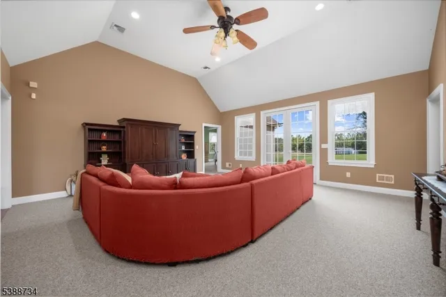 a spacious bedroom with a bed and a window