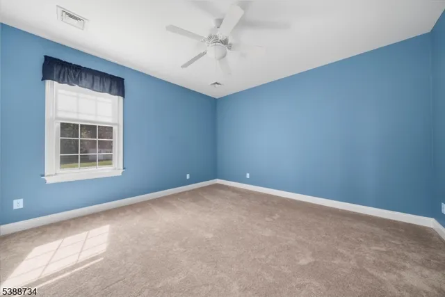 a bathroom with a sink a mirror and a toilet
