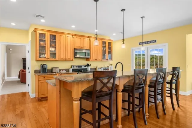 a view of a swimming pool and chairs