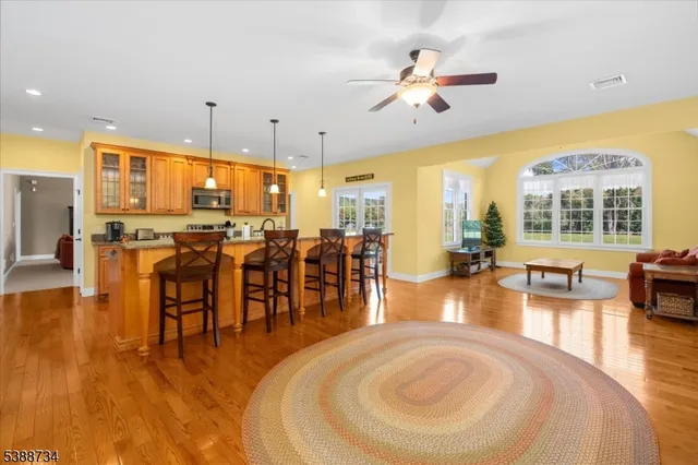 a living room with furniture a flat screen tv and a window
