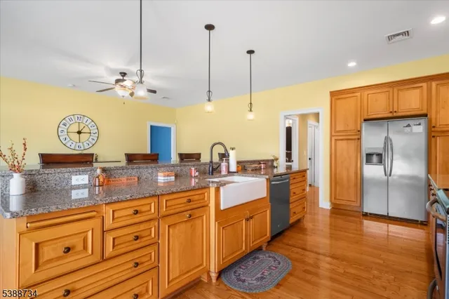 a bathroom with a sink mirror and toilet