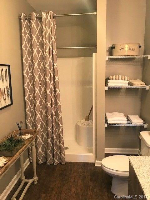 355 Amistead Avenue Fort Mill, SC 29708 - Photo 13 of 23 a bathroom with a toilet and a shower