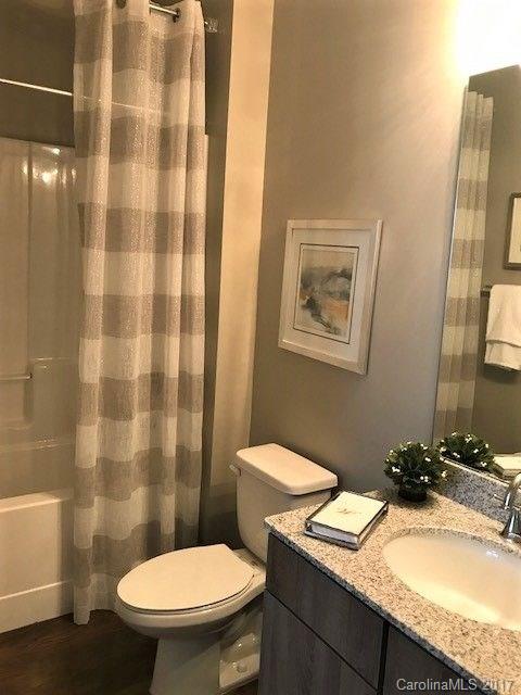 355 Amistead Avenue Fort Mill, SC 29708 - Photo 14 of 23 a bathroom with a granite countertop sink toilet and shower