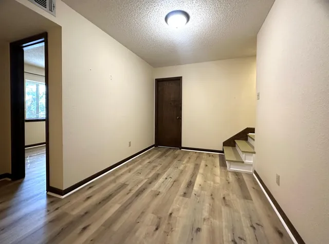 a view of a porch with wooden floor and city view