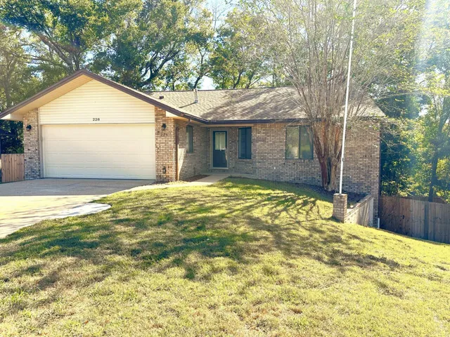 a view of an empty room with a fireplace