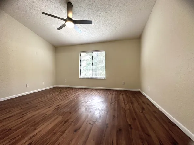a bathroom with a double vanity sink toilet mirror and shower