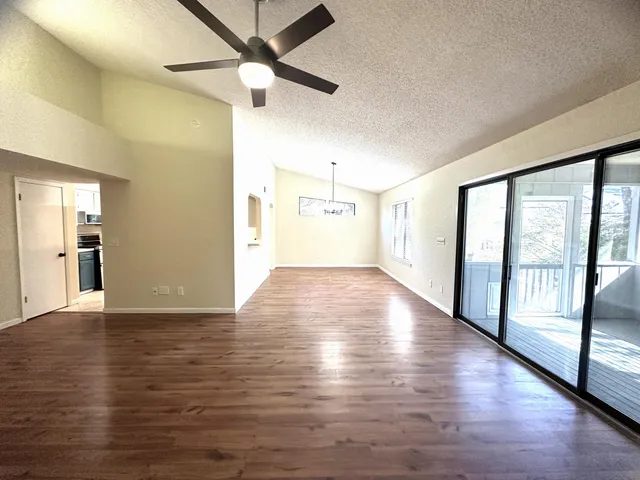 a view of a chairs and table in the patio