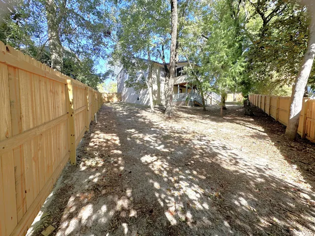 a bathroom with a toilet sink and a mirror