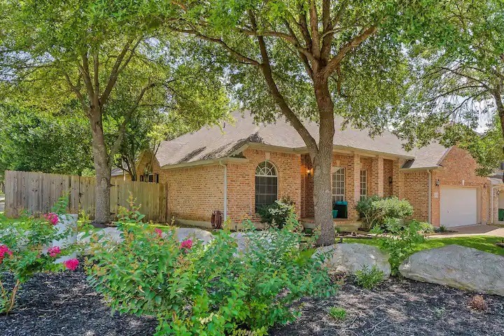 221 Trophy Pass Austin, TX 78748 - Photo 1 of 1 a front view of a house with garden