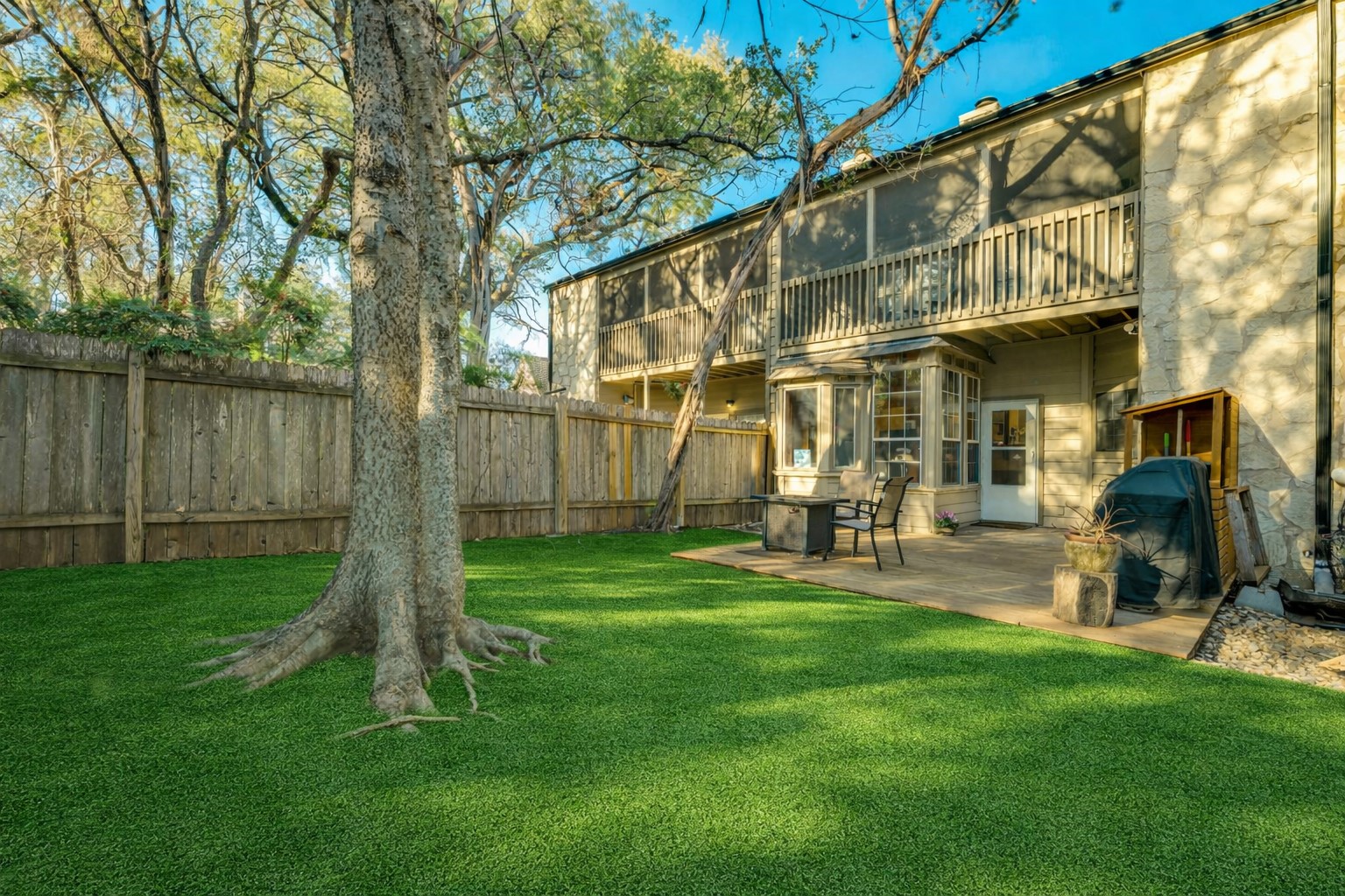 3809 Spicewood Springs Road, Unit 150 Austin, TX 78759 - Photo 5 of 35 This photo is AI generated to show what artificial turf could look like in the backyard