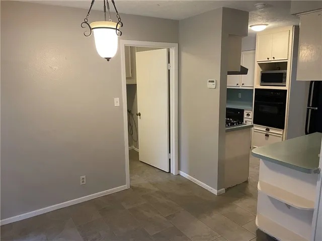 a view of a kitchen from the hallway