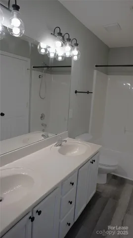 a bathroom with a shower and a bath tub