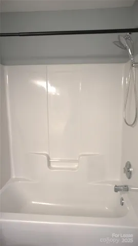 a view of a hallway with a wooden floor