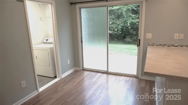 a view of a bathroom with wooden floor