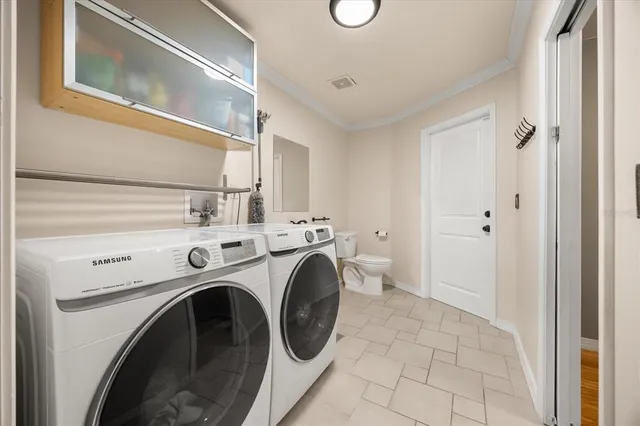 a bedroom with a large bed and a tv