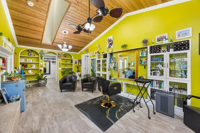 a backyard of a house with a yard and large tree