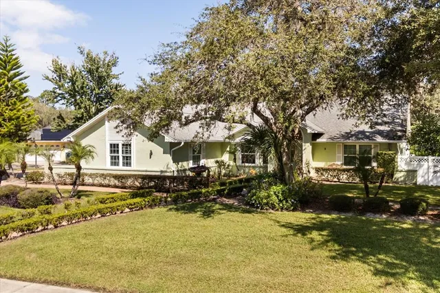 a view of a livingroom with furniture hardwood floor and workspace