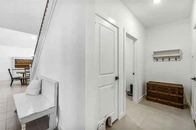 a view of room with furniture and a gate