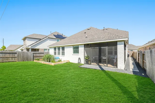 a front view of a house with a yard and porch