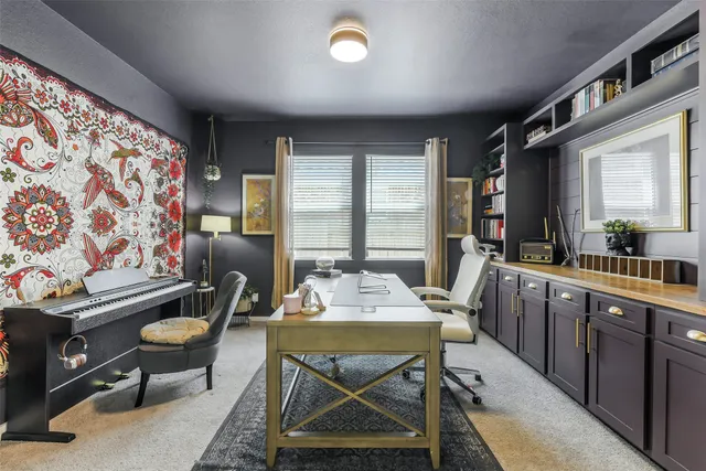 a view of a dining room with furniture and window